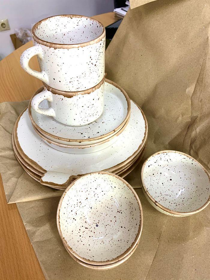 Crafting Captivating Headlines: Your awesome post title goes here From above set of new white ceramic dinnerware with black spots stacked on packing paper